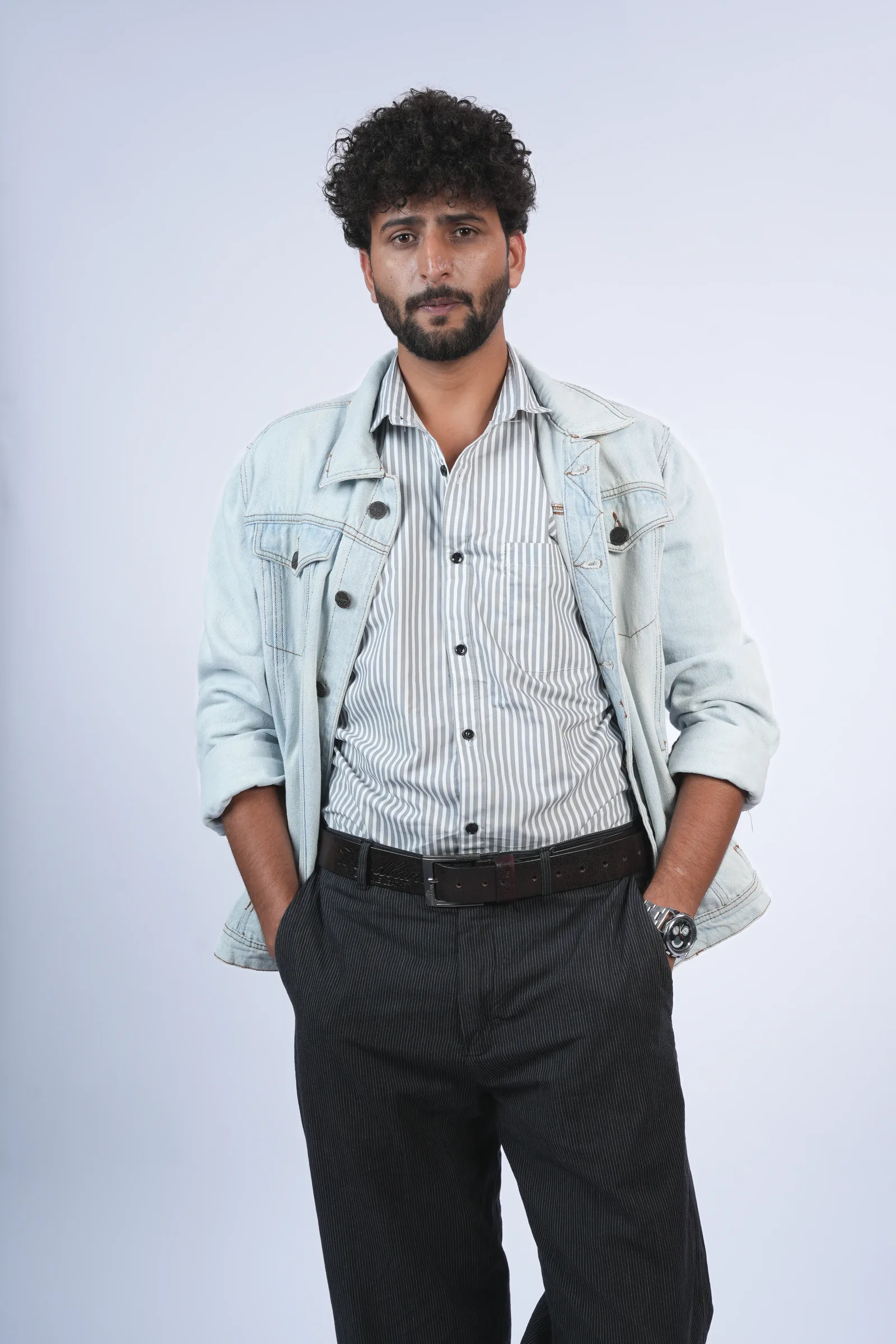 Studio headshot, denim jacket