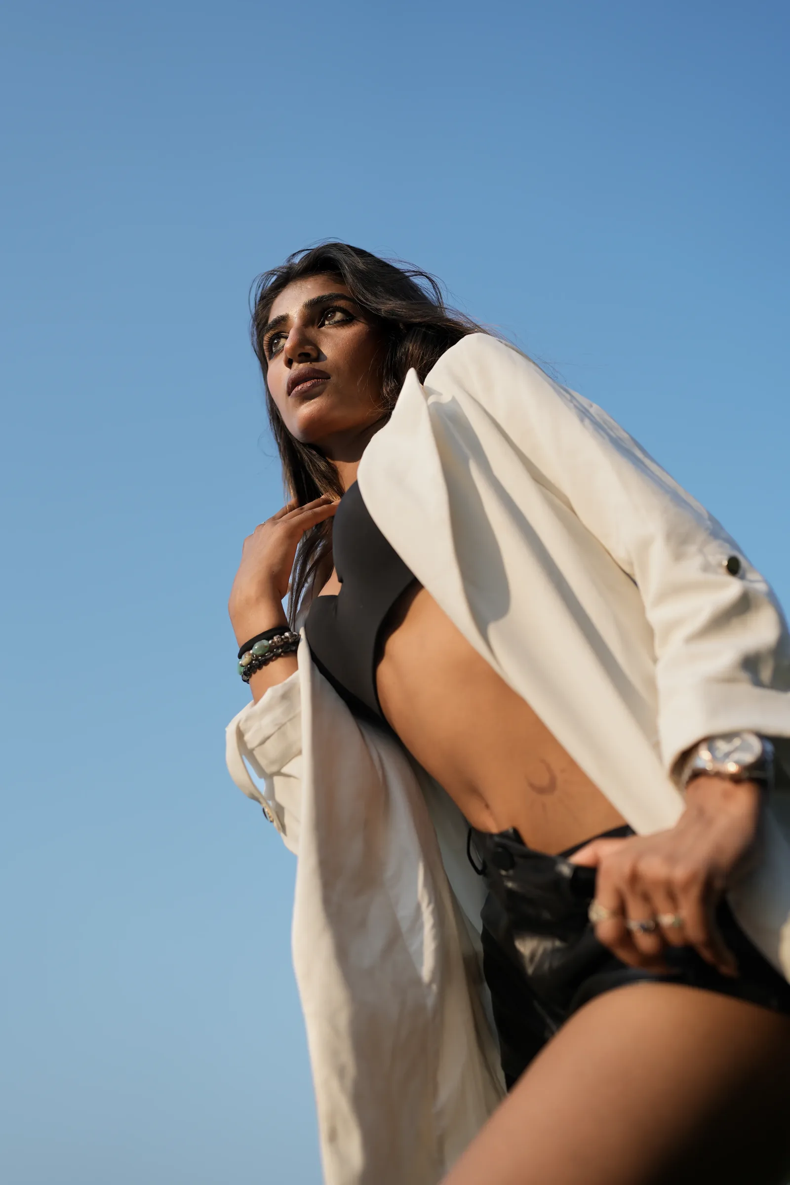 Editorial portrait against blue sky