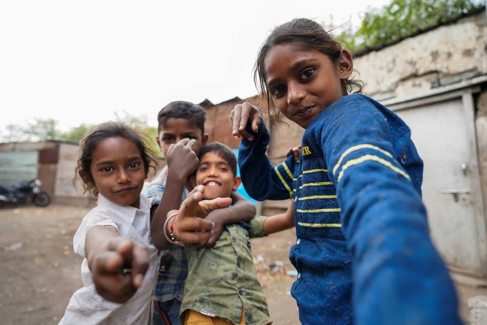 Children pointing at camera