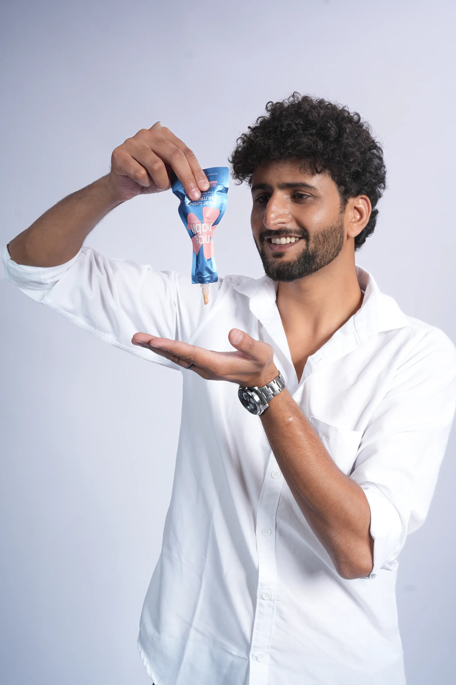 Male model demonstrating hair product