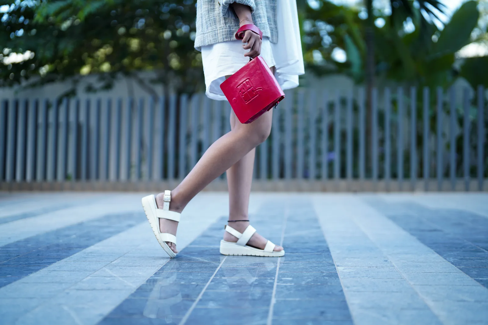 Candid walking shot with red bag