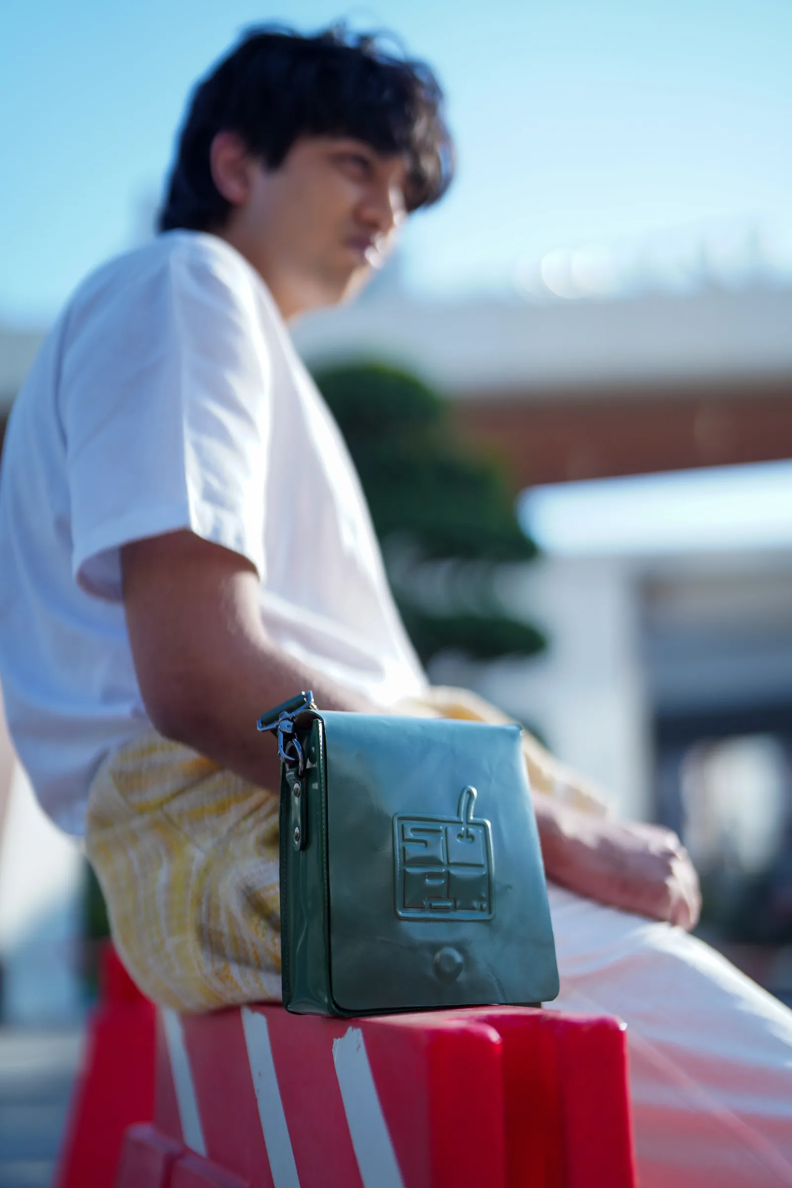 Focus-pulled shot of a green bag