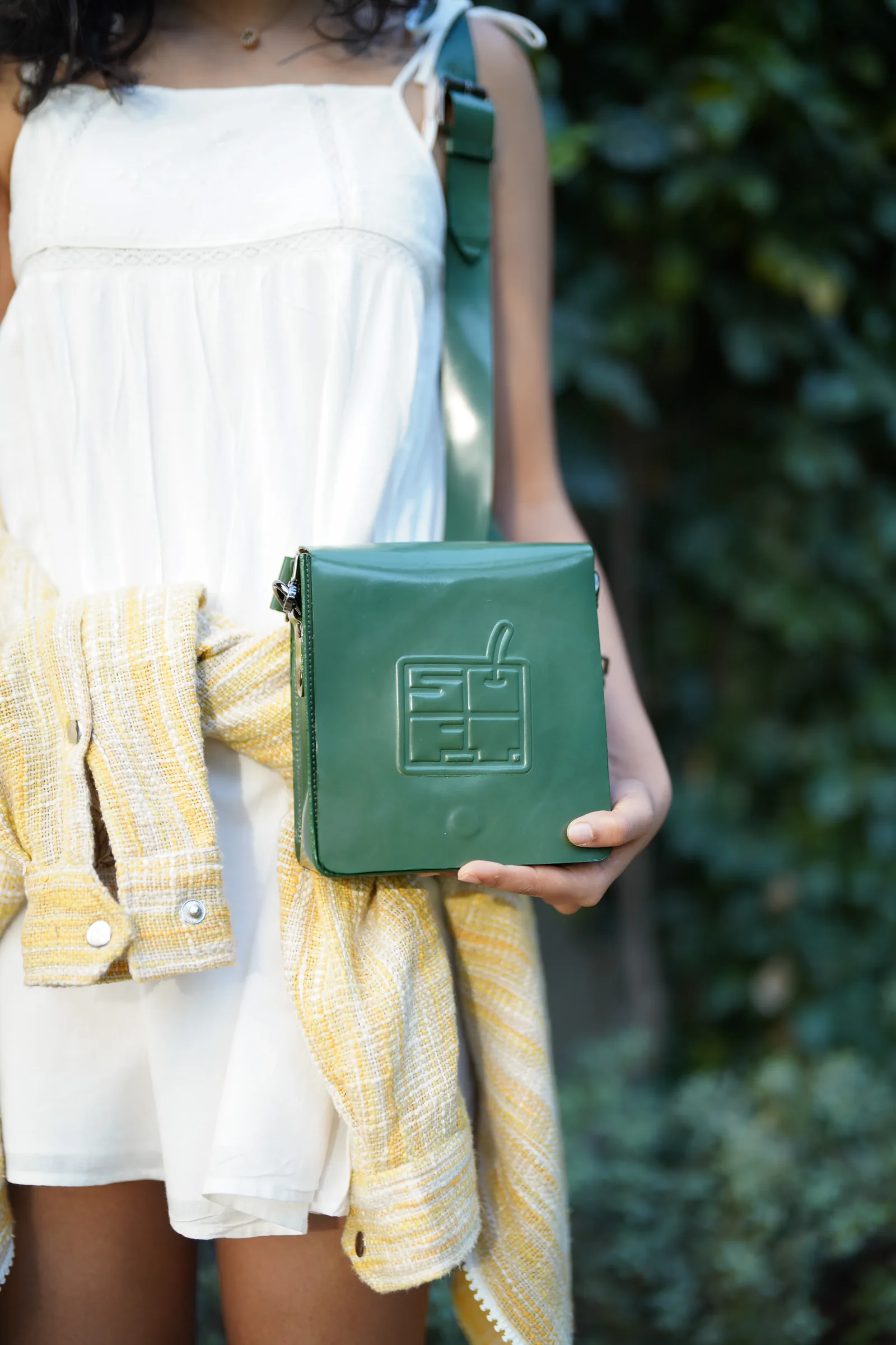 Close-up detail of a green leather bag